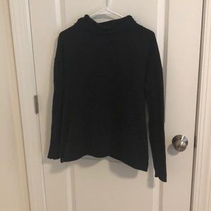 Black turtle neck w/ split back